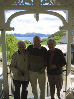 David & Wynne with Tormond Moe on steps of his farmhouse, Hemnefjord in the background