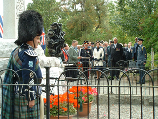 Piper watching Gerry Robb, Lord Lt Aberdeenshire, HRH Princess Royal and Andy Brown